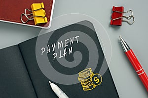 Financial concept about PAYMENT PLAN with sign on the page. AÃÂ termÃÂ payment planÃÂ involves receiving equal monthlyÃÂ paymentsÃÂ  photo